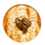 Baba ganoush which is made from roasted eggplant with tahiny in white bowl