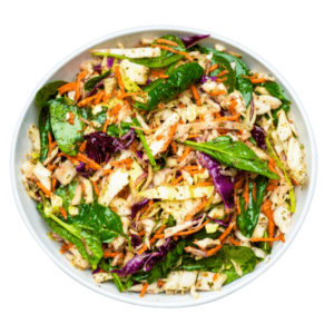 Cabbage Salad with spinach lemon gharlic and mint in a white bowl