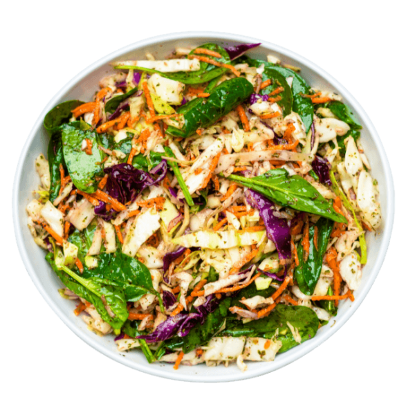 Cabbage Salad with spinach lemon gharlic and mint in a white bowl