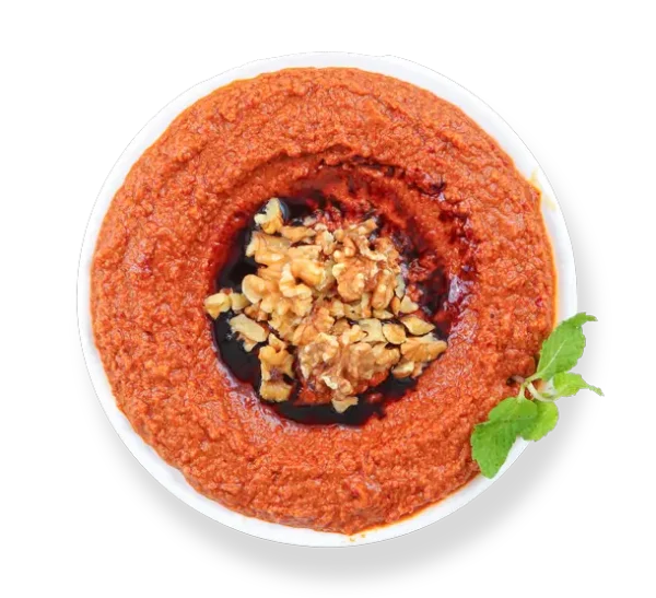 Muhammara dip from Aladdin Mediterranean Cuisine—roasted red pepper & walnut spread drizzled with olive oil.