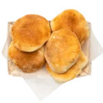 Freshly baked pita bread, a classic Mediterranean staple served warm at Aladdin Mediterranean Cuisine in Houston