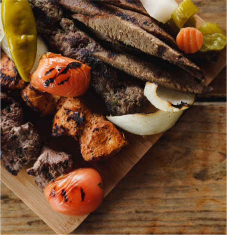 chicken and beef shawarma with grilled vegetables