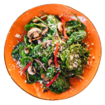 Spinach Feta Salad with bell pepper and mushroom in a sound orange plate