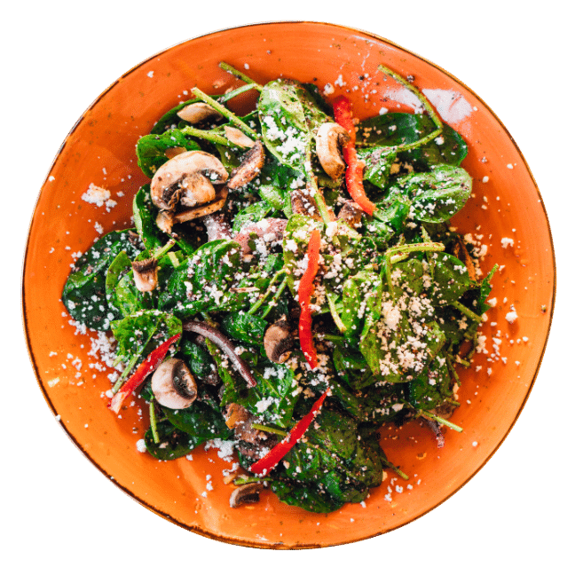 Spinach Feta Salad with bell pepper and mushroom in a sound orange plate