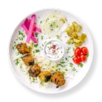 Filet Lamb Kabob with pickles tomatoes and cabbage and garlic sauce Aladdins Houston