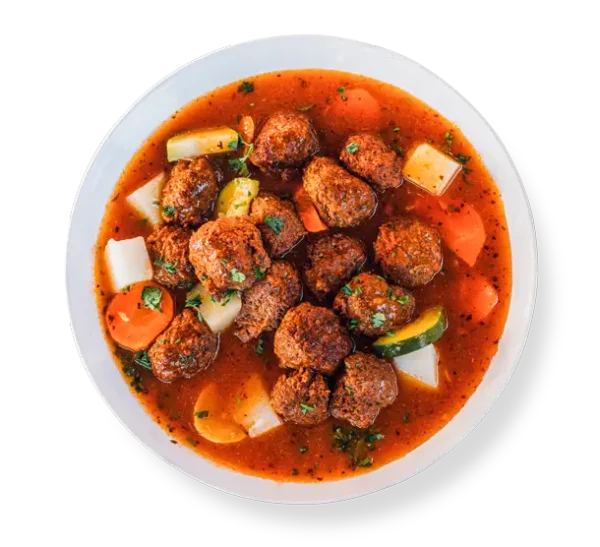 Gluten-free spicy lamb meatballs in smoky chipotle gravy, plated at Aladdins Houston