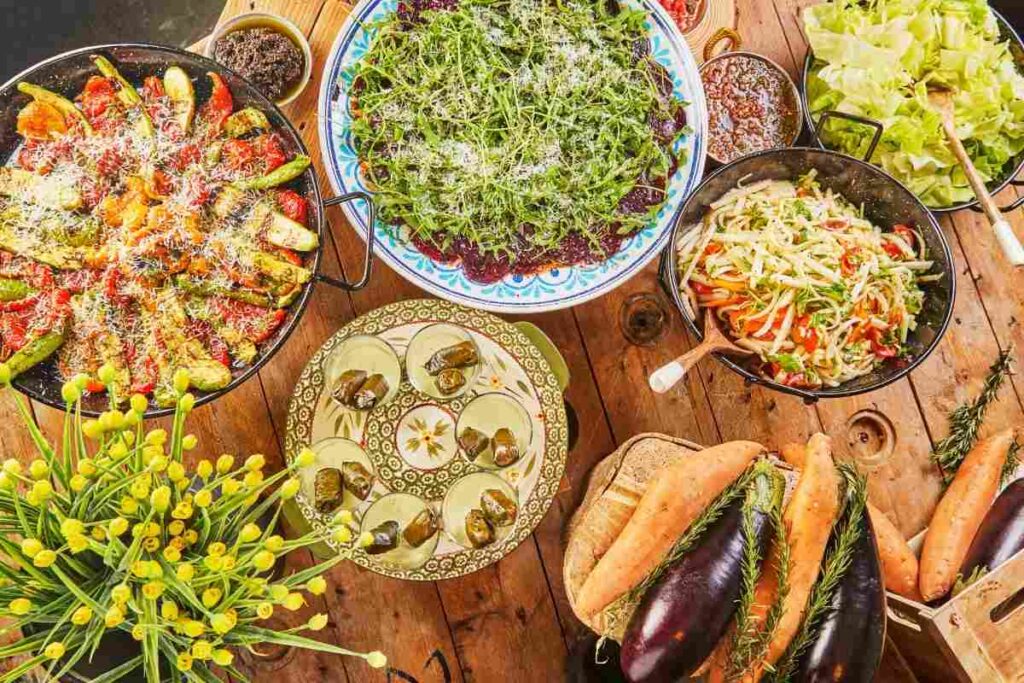 Vibrant vegetarian dishes including roasted vegetables, tabbouleh, and grape leaves – Mediterranean cuisine in Houston