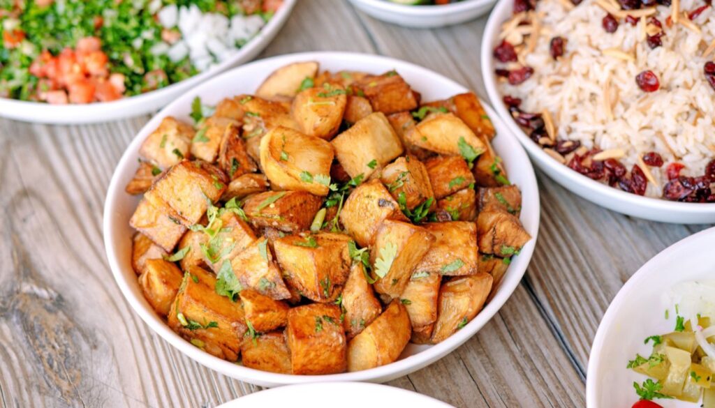 Deliciously roasted golden potatoes dish at Aladdin Montrose. 