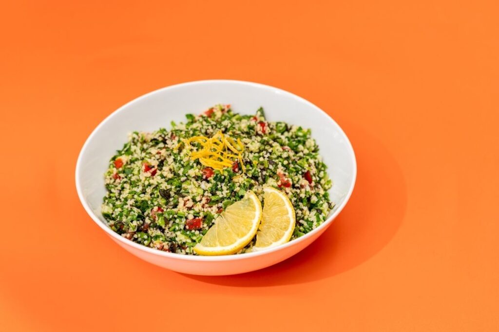 Fresh tabbouleh salad made with parsley, bulgur, tomatoes, and lemon dressing at Aladdin Mediterranean Cuisine Houston