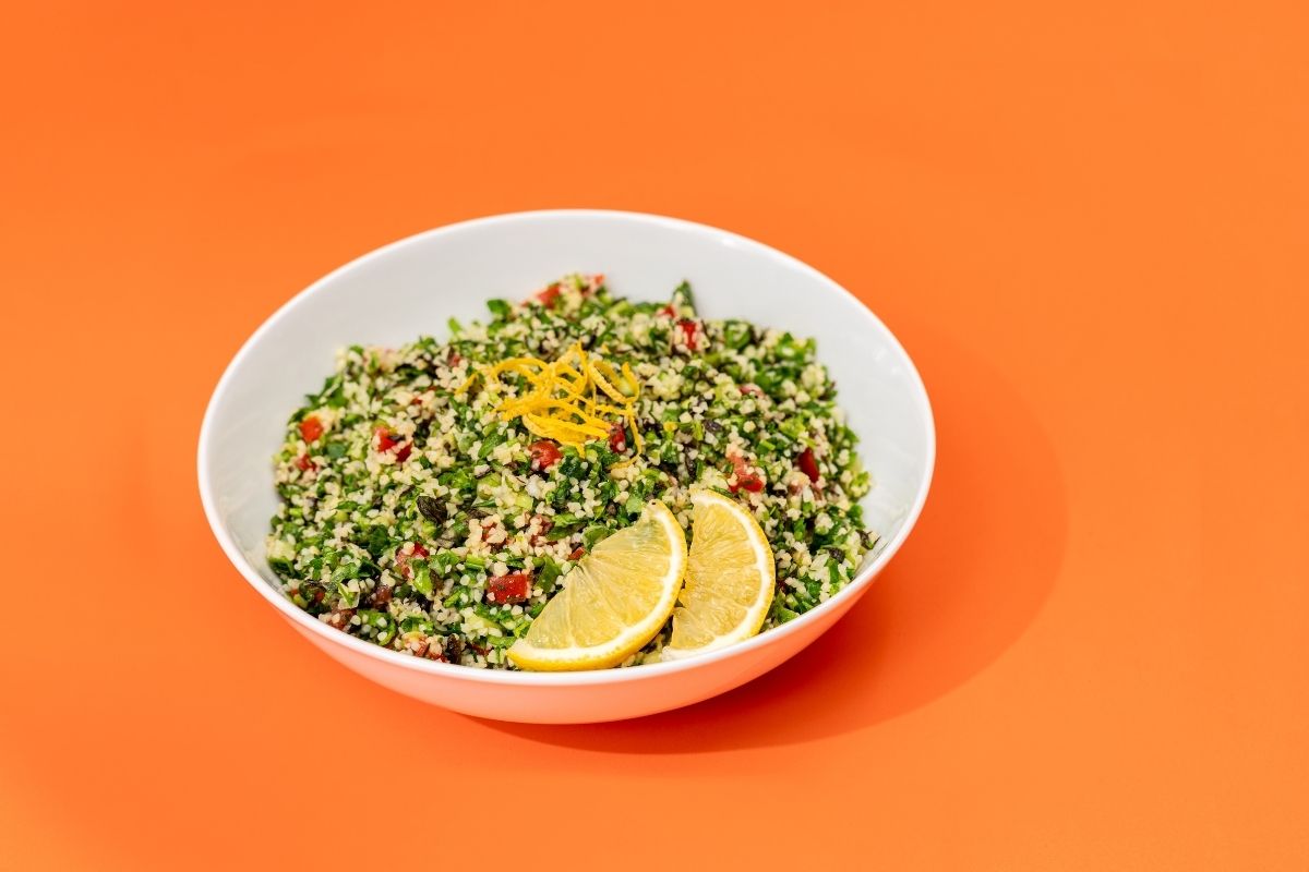 Fresh tabbouleh salad made with parsley, bulgur, tomatoes, and lemon dressing at Aladdin Mediterranean Cuisine Houston