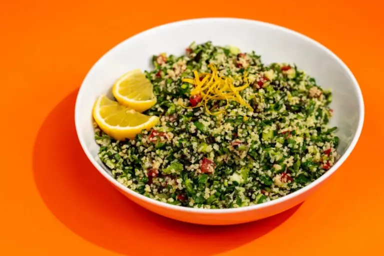Fresh Lebanese tabbouleh with finely chopped parsley, mint, bulgur, cucumber, and tomato.